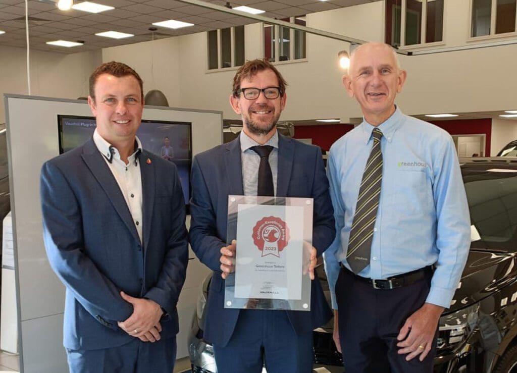Pictured left to right Sales Manager Andy Evans Managing Director Vauxhall Motors Ltd. James Taylor Aftersales Manager Geoff Lowe