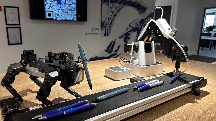 251010 A robot arm and dog collaborate to move objects at490449